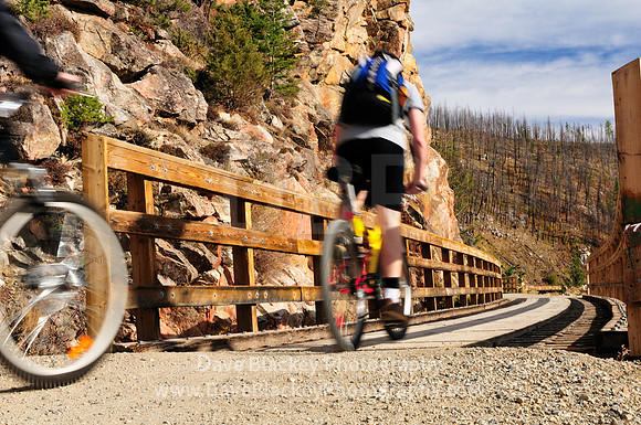 riding through Myra Canyon Trestles and Kettle Valley Railway, Cyclists, biking, Myra Canyon Trestles, Kettle Valley Railway, Kelowna