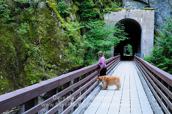 Scenic Othello Tunnels in Hope BC., woman, Golden Retriever