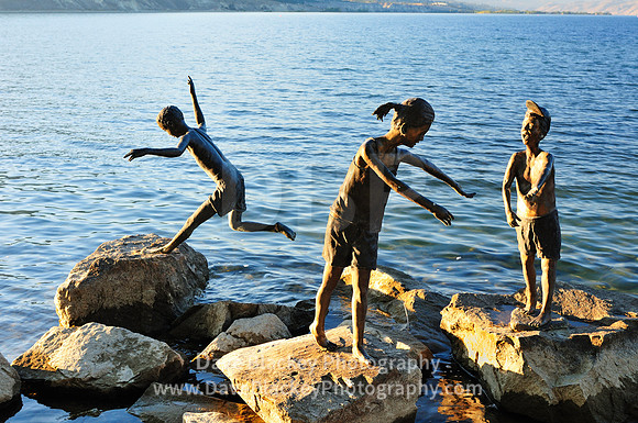 Statues of children playing on rocks Penticton, Statues of children, rocks, water, Penticton